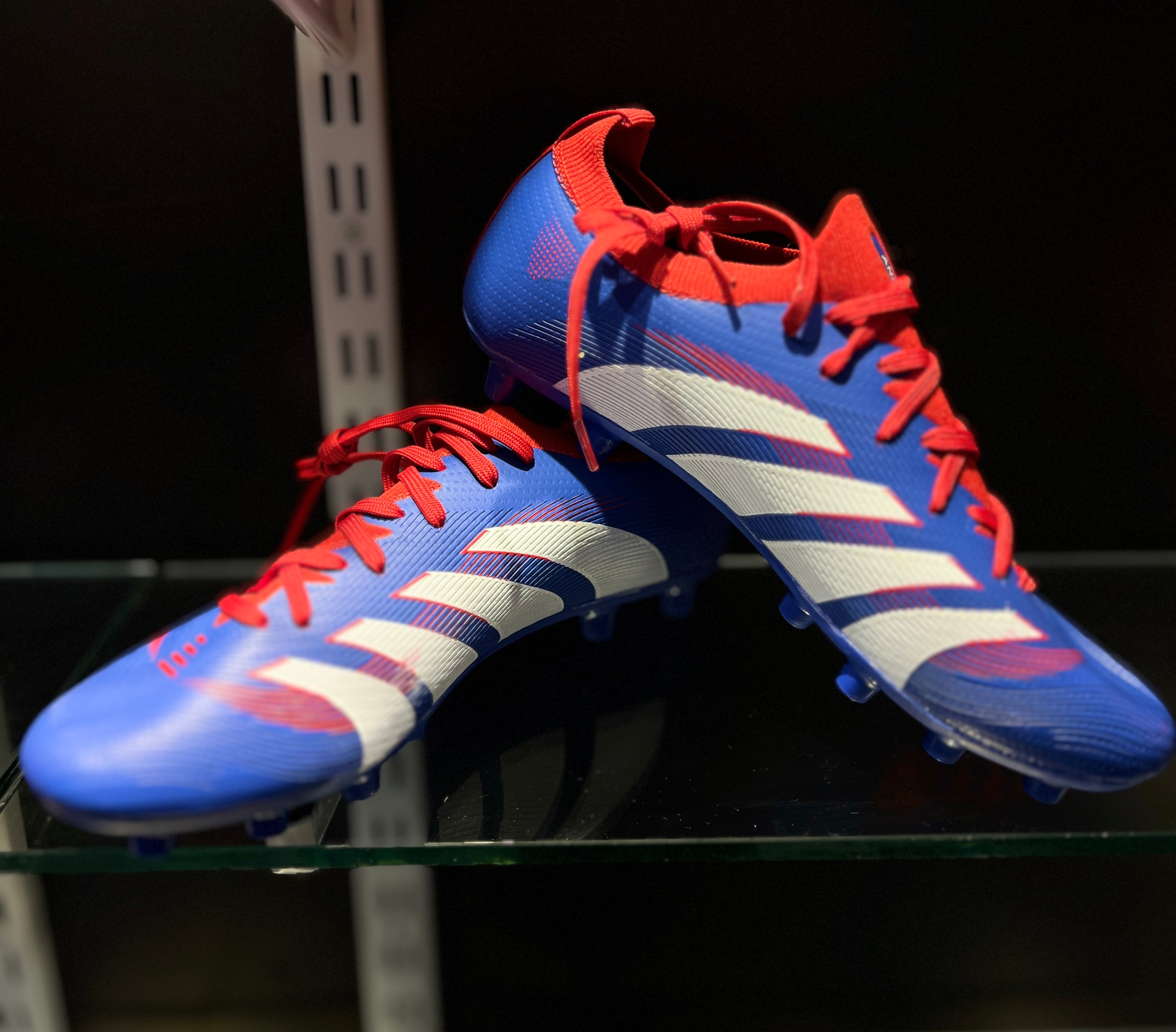 Anza Switch lightweight football boots front and side profile on grass field