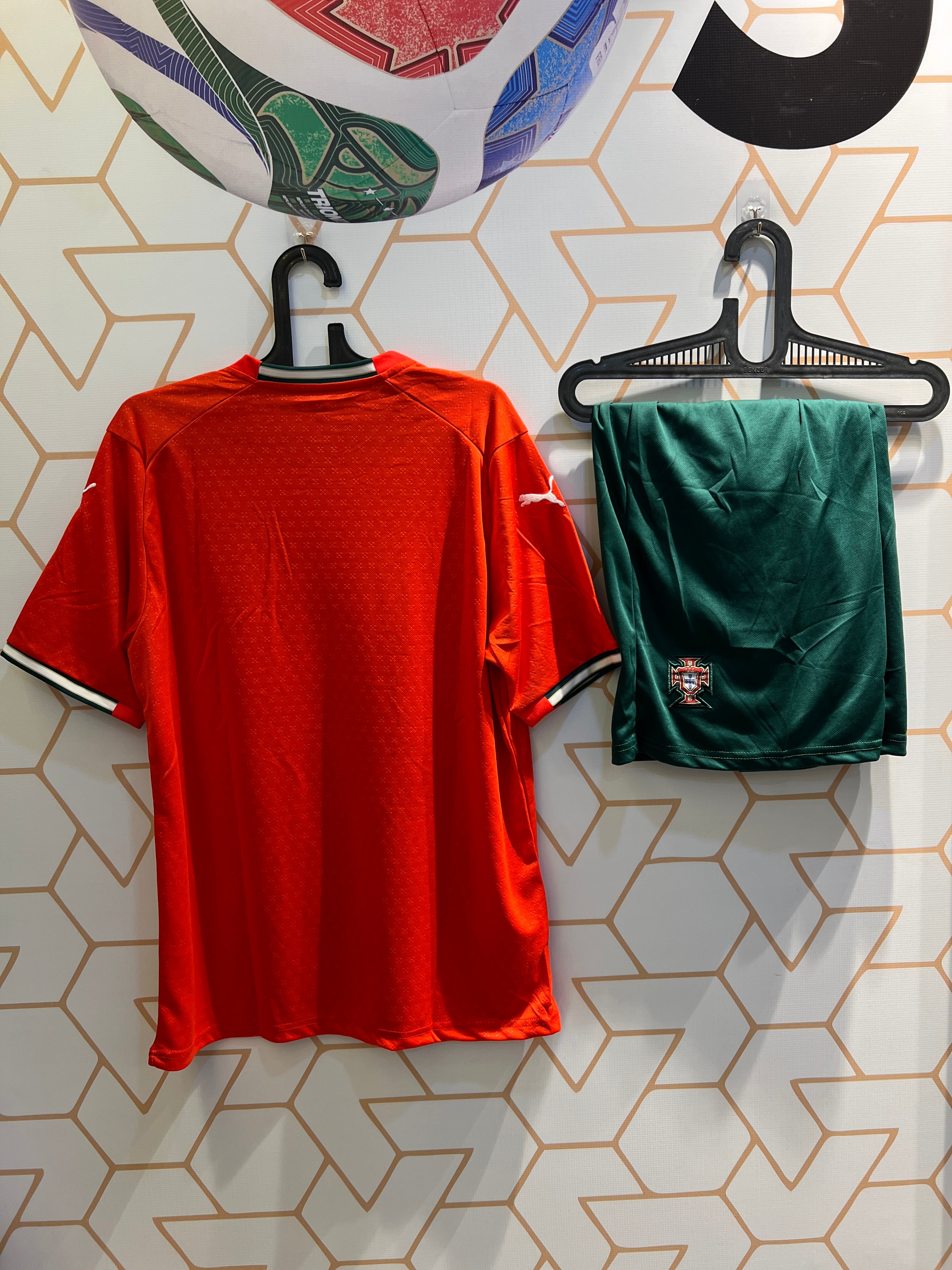 Portugal Home 25/26 football kit laid flat showing full jersey and shorts