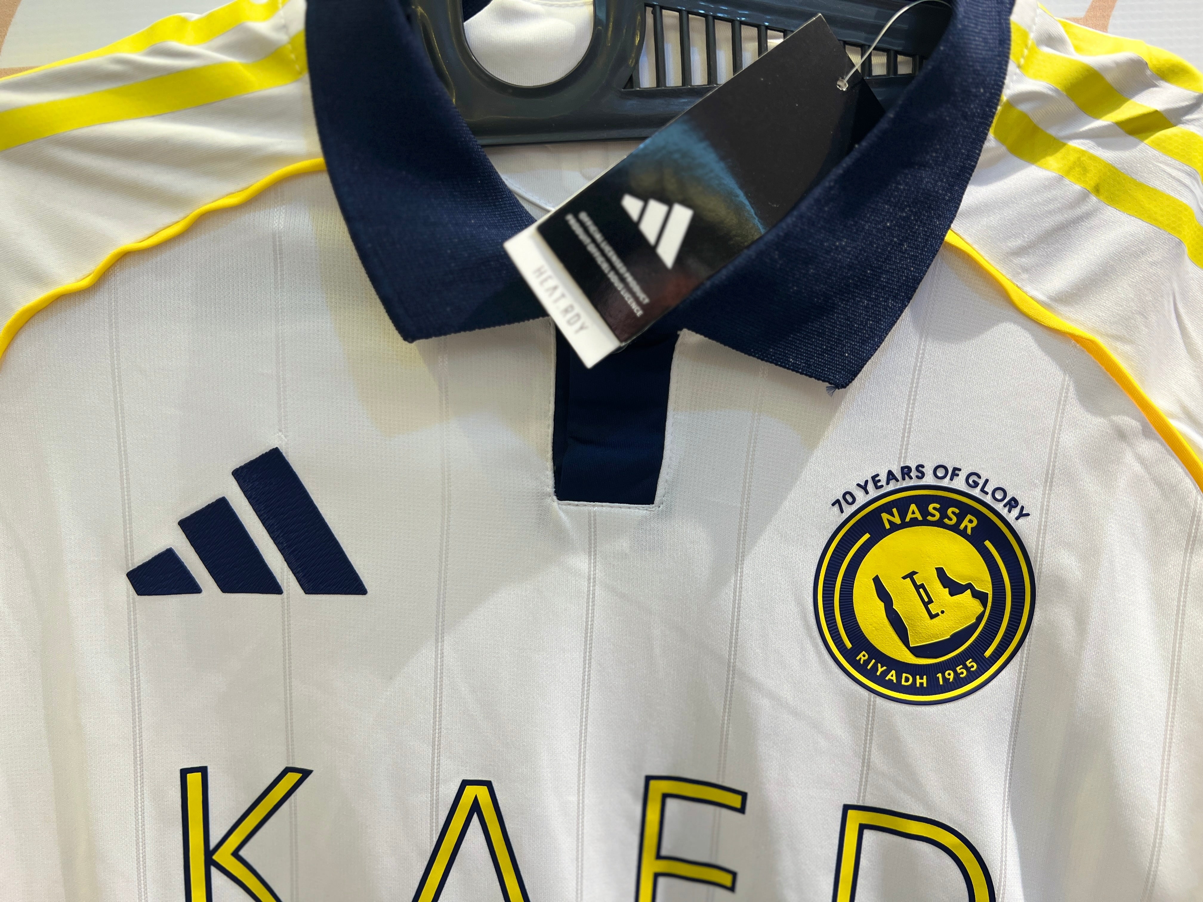 Close-up of Al Nassr Away 25/26 Jersey fabric texture and club crest detail