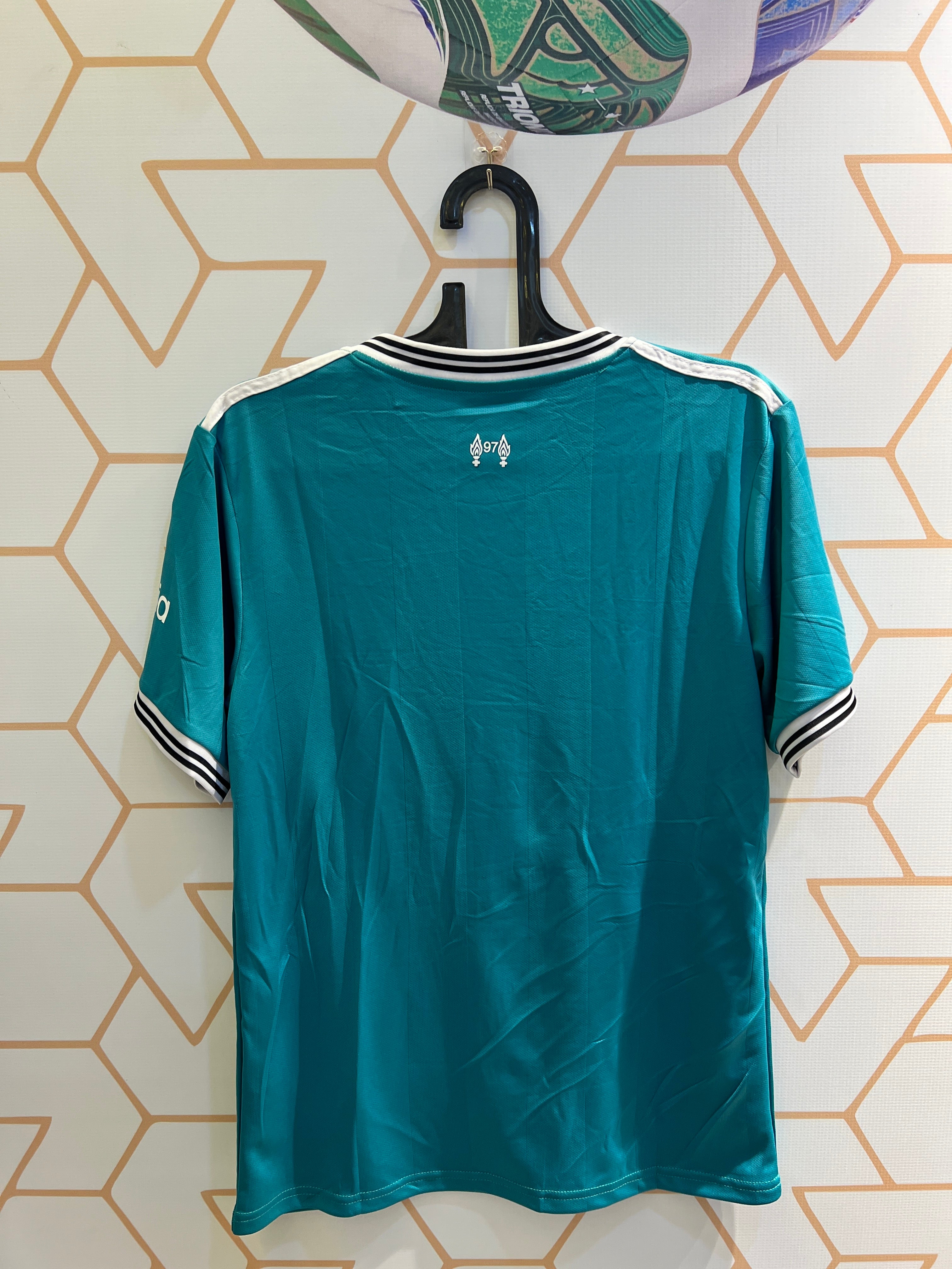 Player wearing Liverpool FC Away Green 25/26 Kit during football training