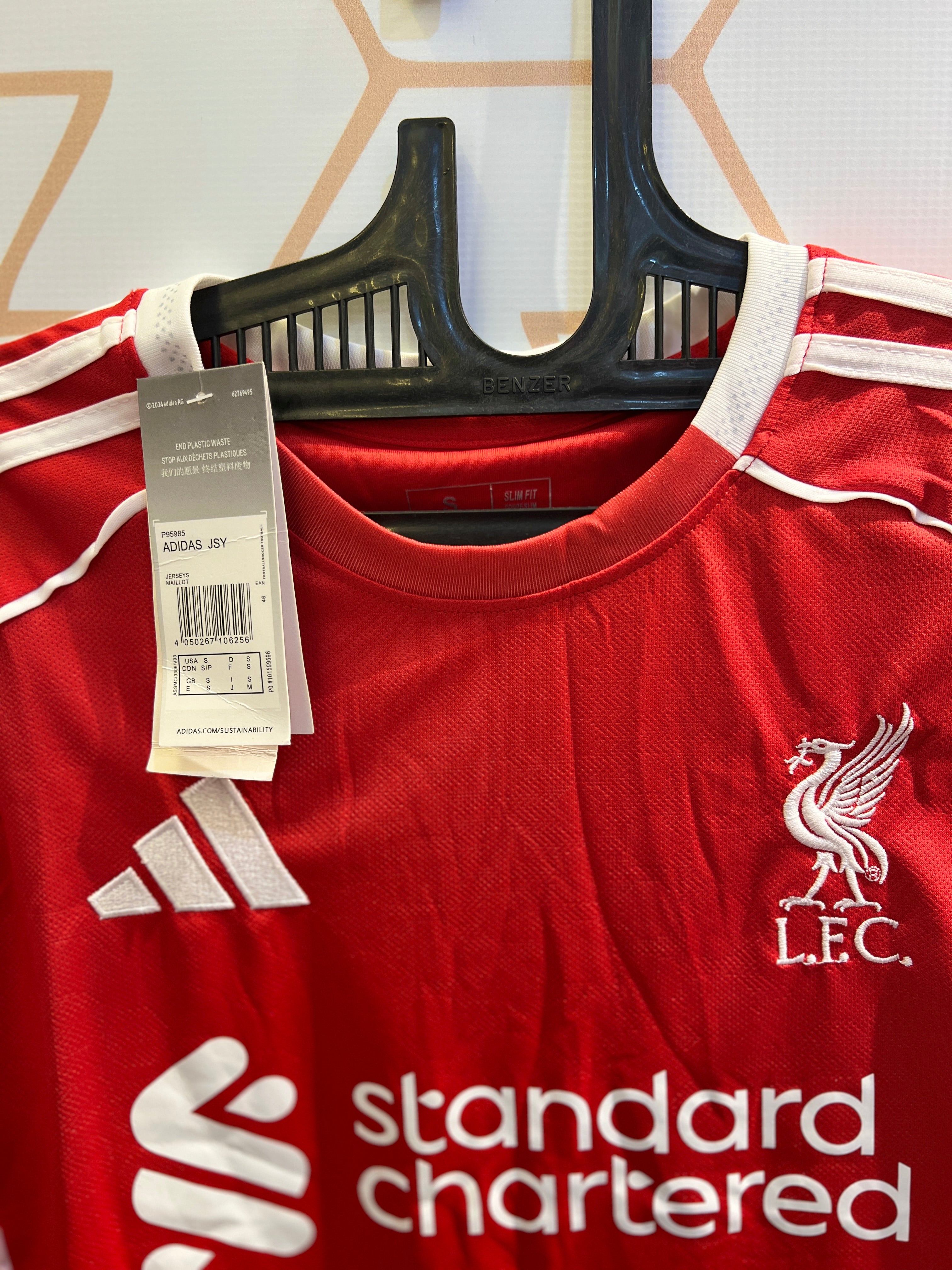 Close-up of Liverpool FC Home 25/26 Kit fabric quality and club crest