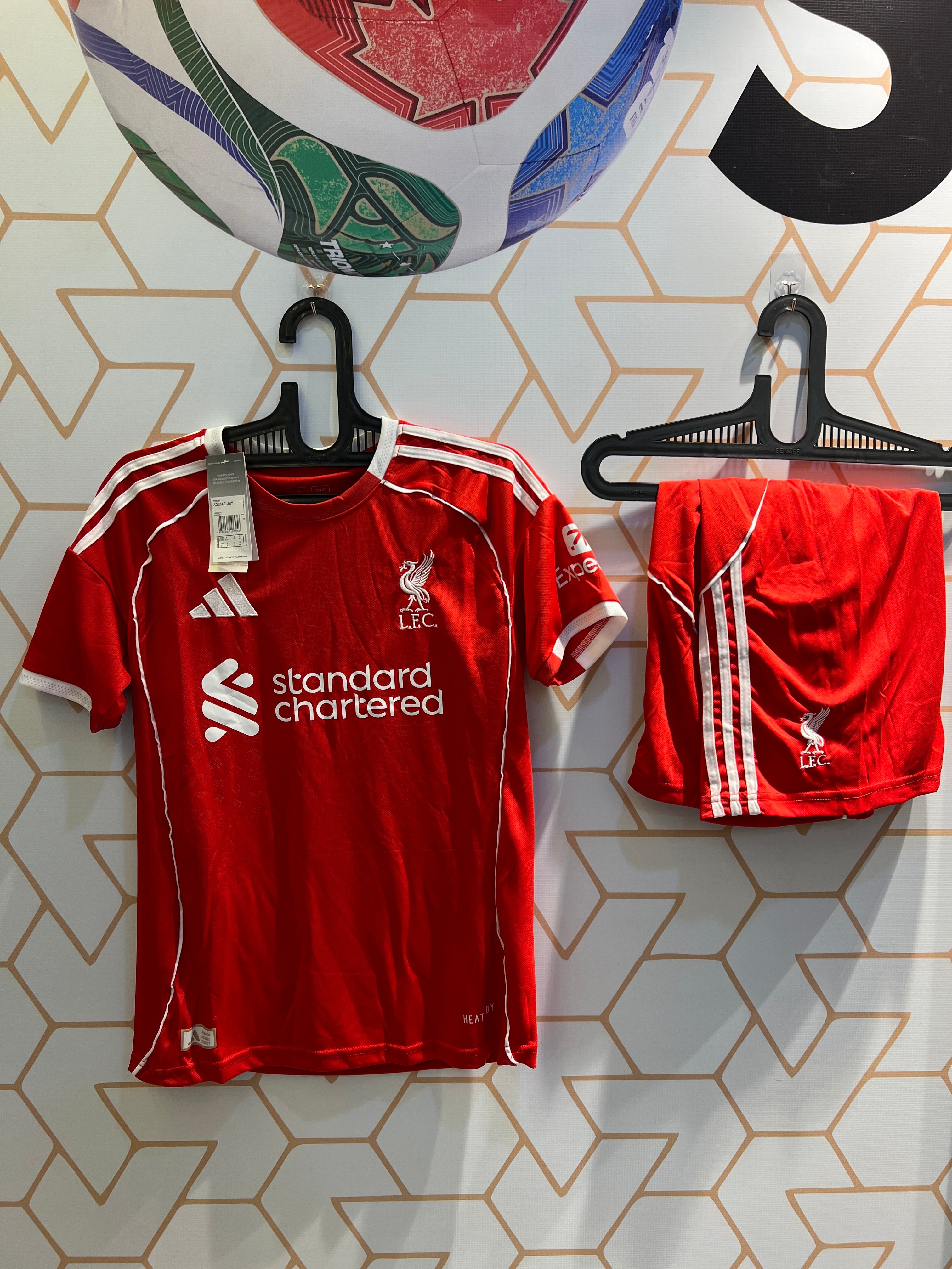 Liverpool FC Home 25/26 Kit front view red football jersey and shorts for fans