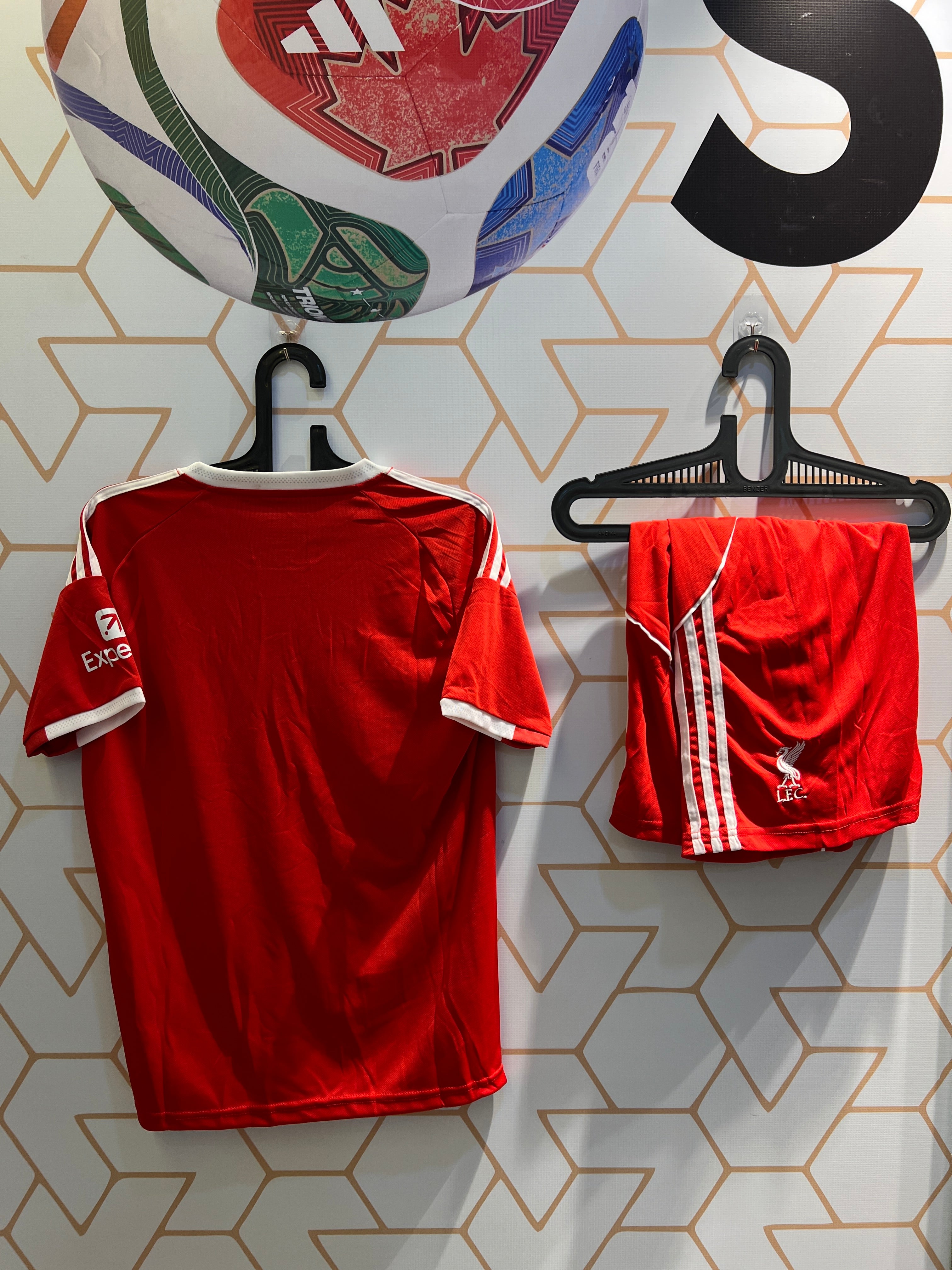 Player wearing Liverpool FC Home 25/26 Kit during football match training