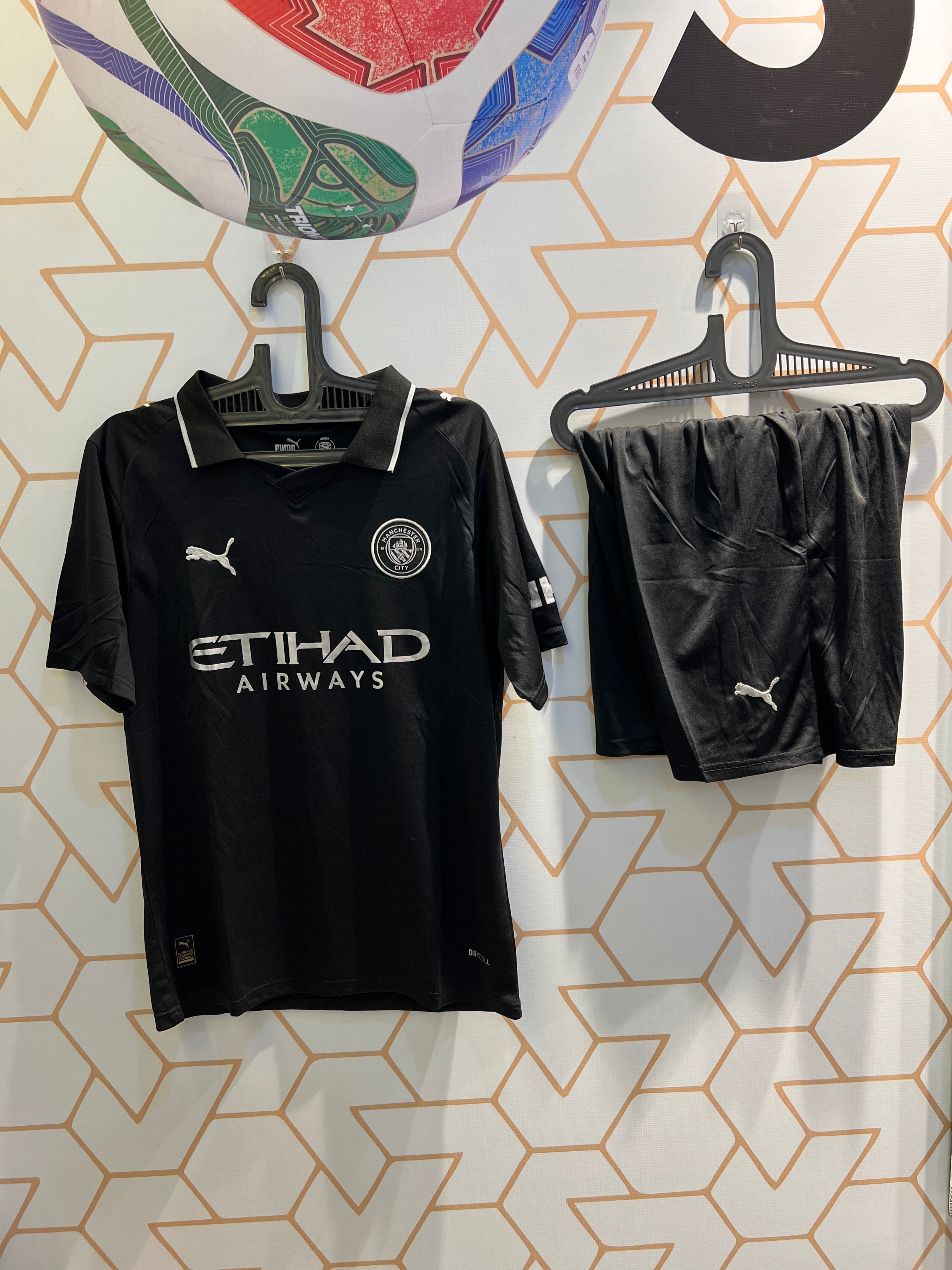 Man City Away Black 25/26 Kit front view sleek football jersey and shorts for fans