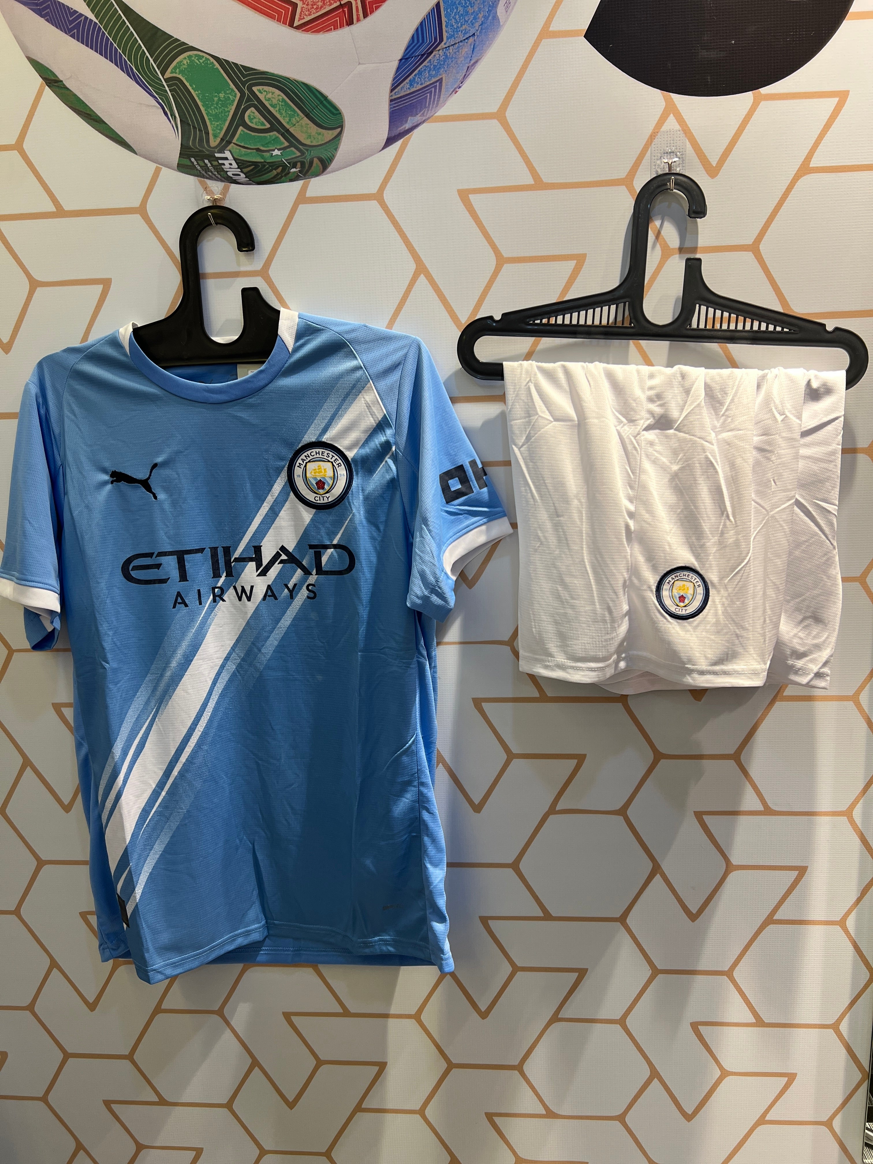 Man City Home Blue 25/26 Kit front view light blue football jersey and shorts