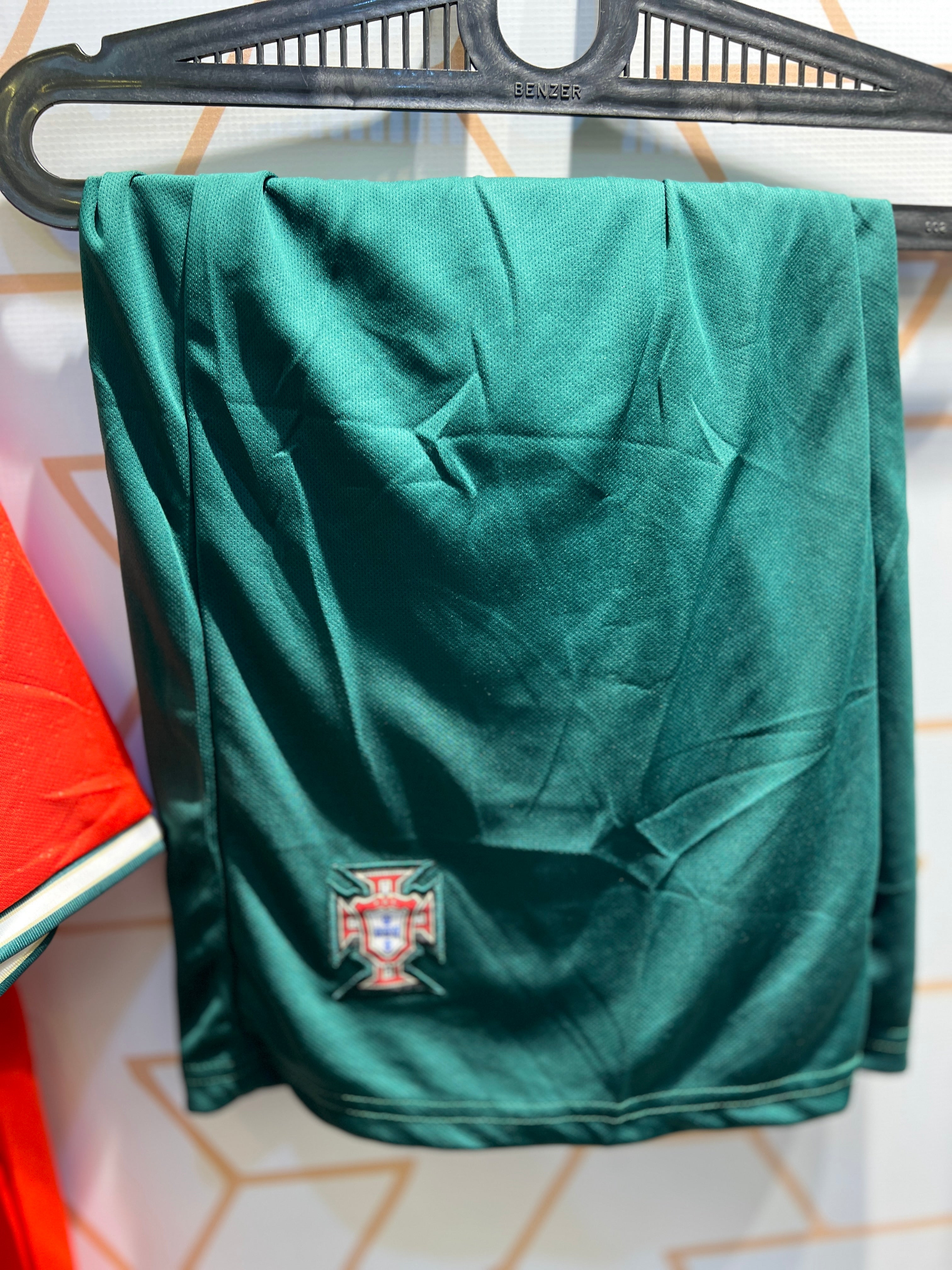 Cristiano Ronaldo wearing Portugal Home 25/26 kit red jersey during match