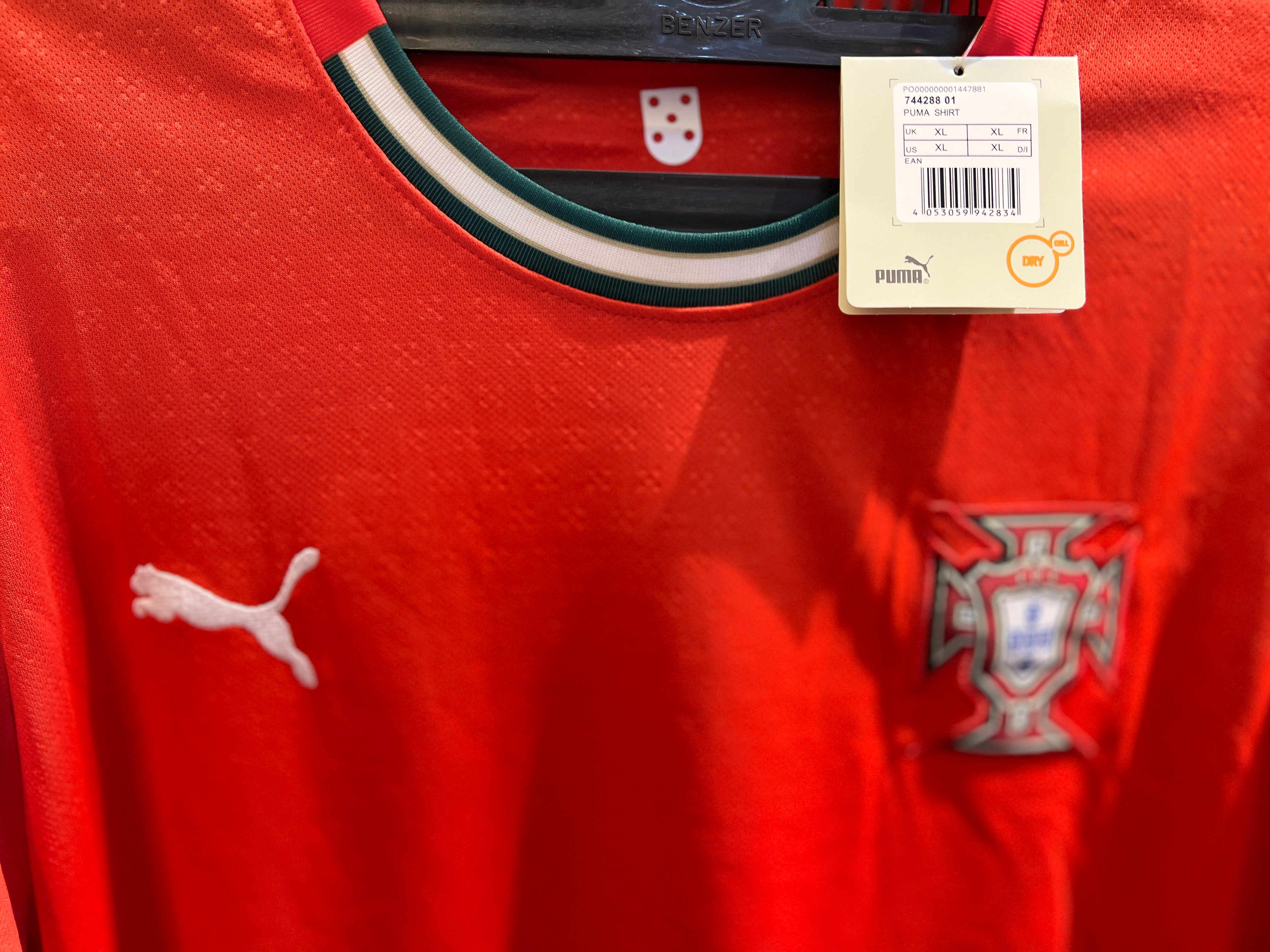 Close-up of Portugal 25/26 home kit crest and breathable fabric texture