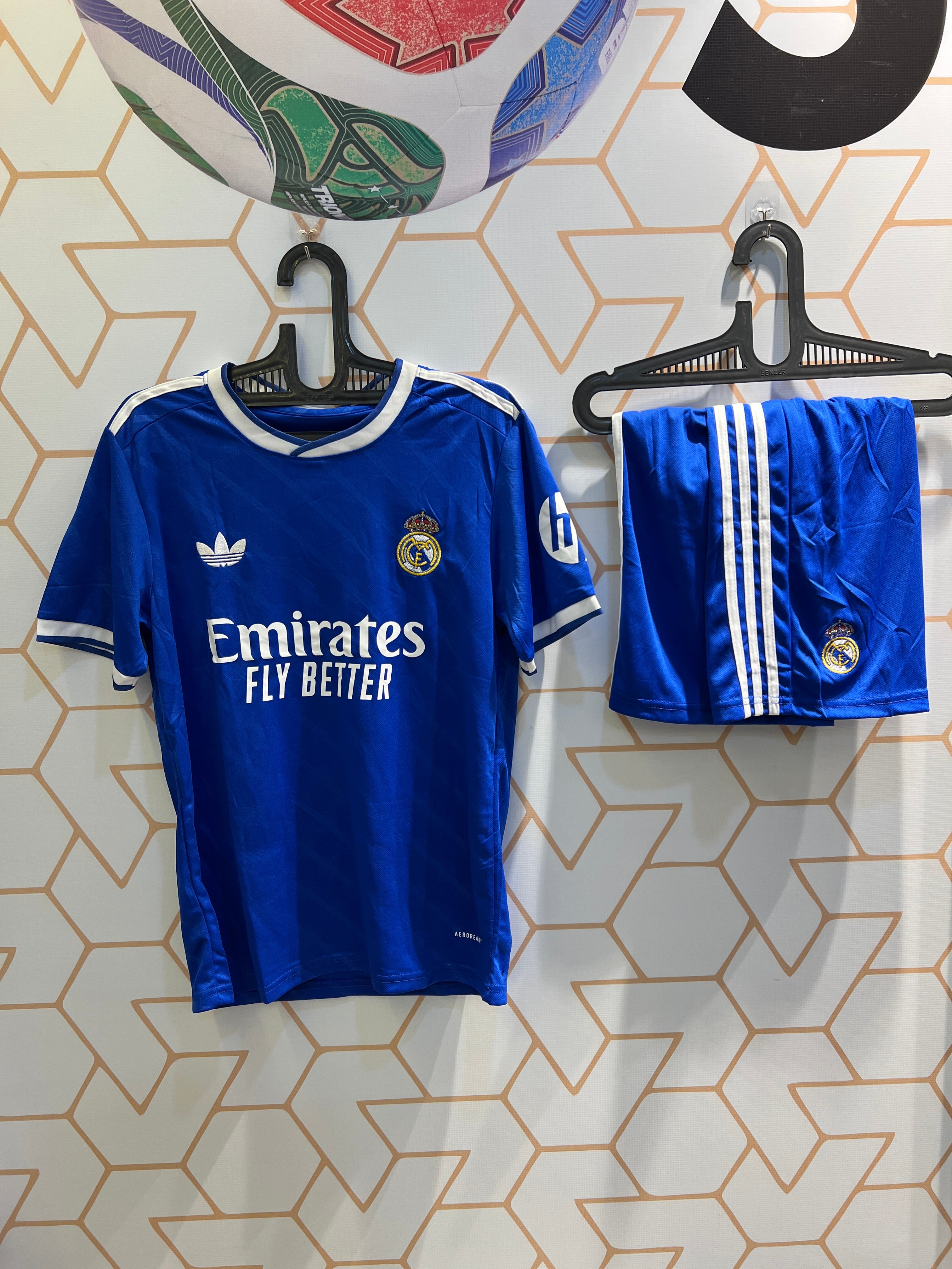 Real Madrid Away 25/26 Kit front view blue jersey and shorts